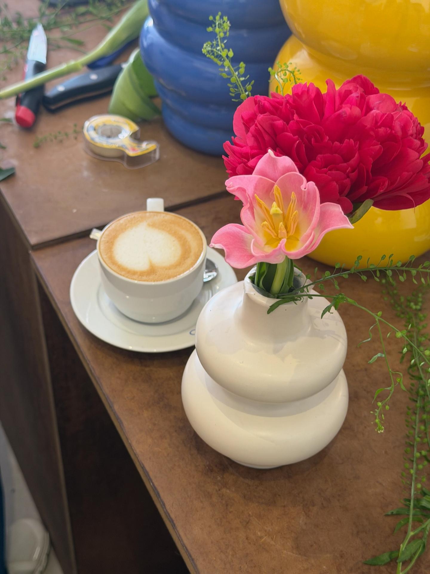 Peony and pink tulip in a sculptural white vase